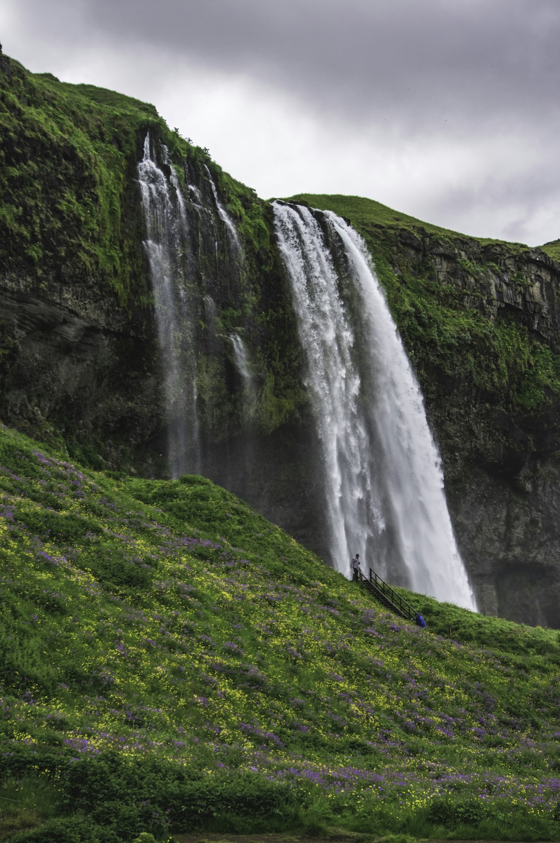 Seljalandsfoss falling against a grey Icelandic sky