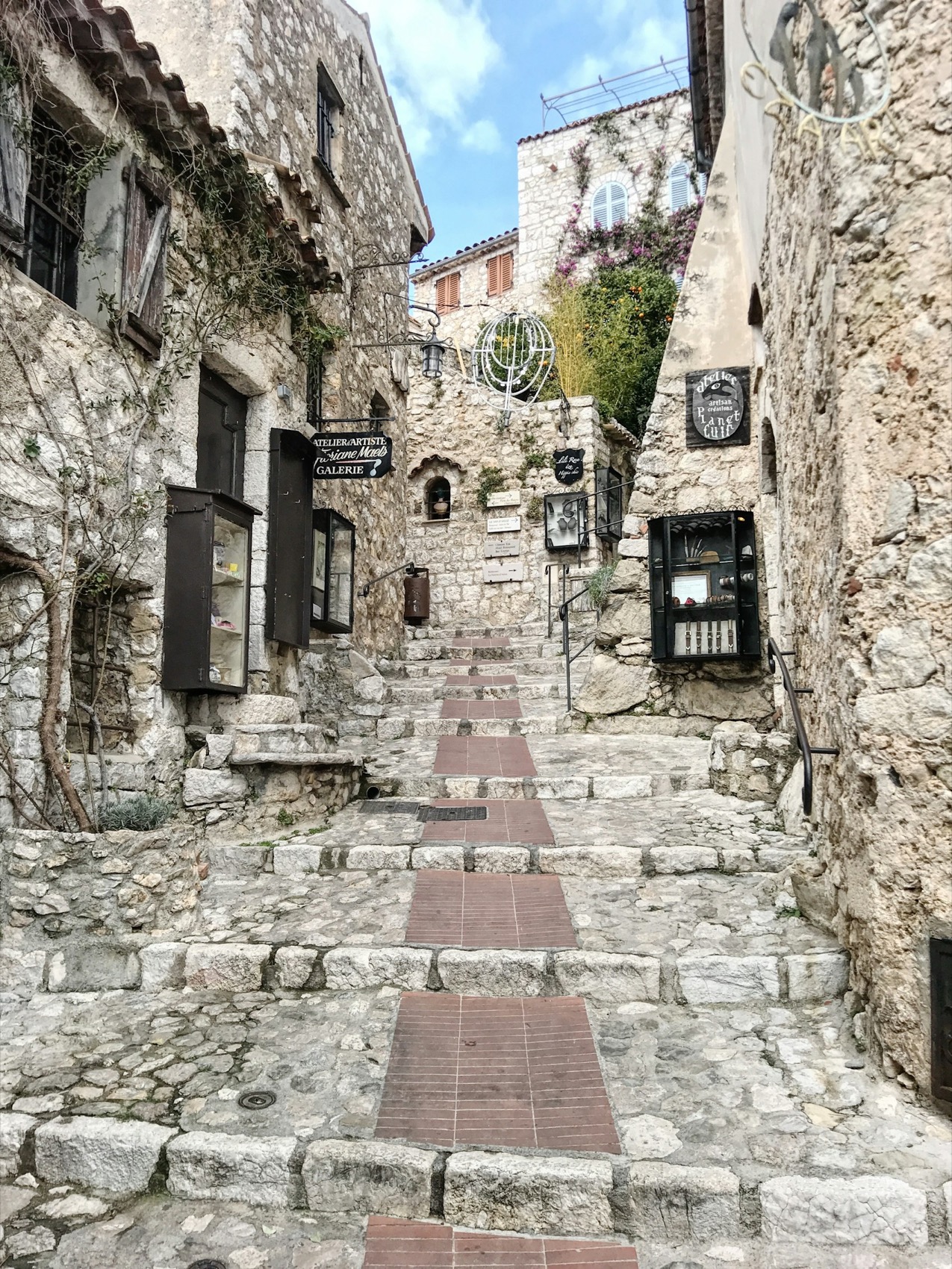 A cobbled stepped lane climbing through the stone village of Eze above the Cote d'Azur